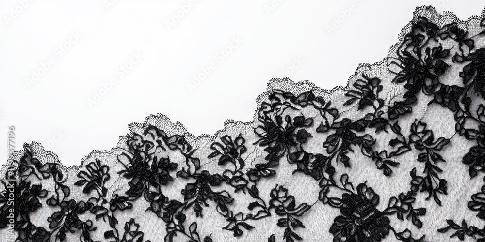 Naklejka premium Delicate black lace textile draped on a pristine white background creating elegant contrast with ample space for design and text integration