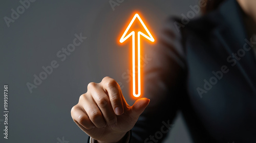 A businesswoman pointing upwards with a glowing arrow, symbolizing progress and success. photo