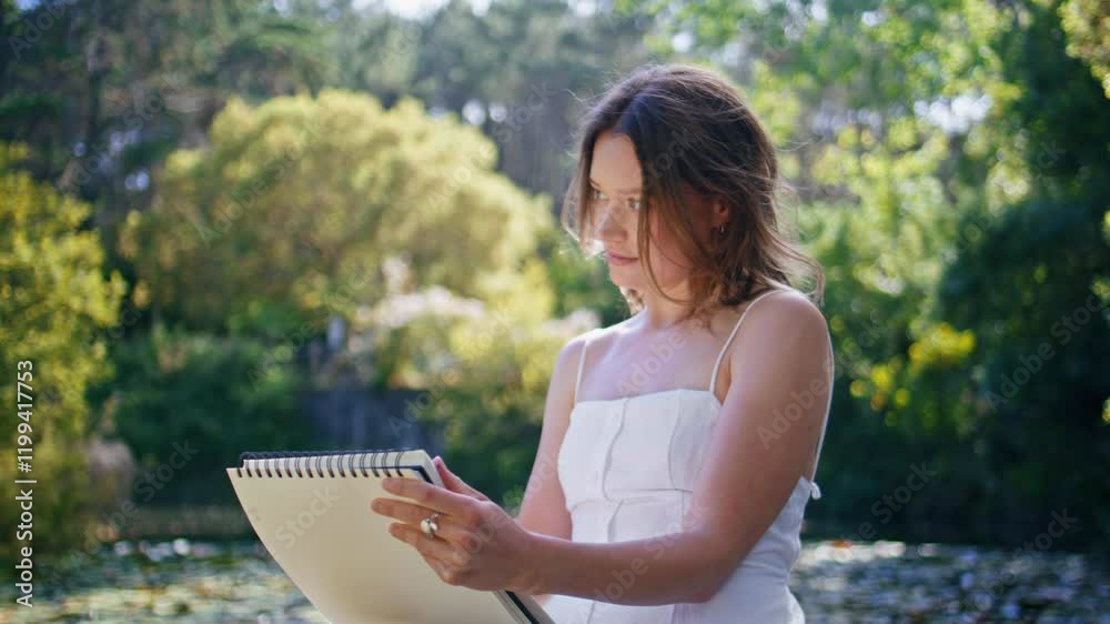 Inspired woman painting lake nature view closeup. Artist relaxing wild jungles Inspired woman painting lake nature view closeup. Artist relaxing wild jungles