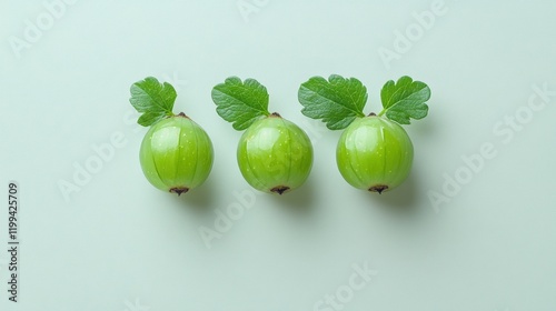 Fresh Green Gooseberries with Leaves on Soft Mint Background