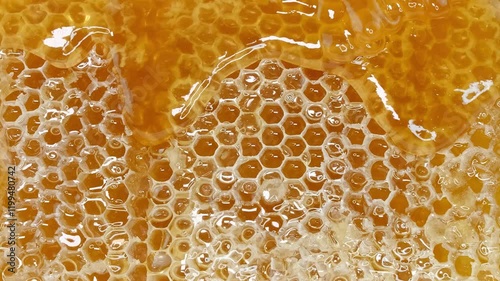 honey flowing over natural honeycomb