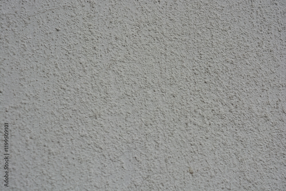 Architecture, construction, construction works. Beautiful cement walls covered with white primer with stones and roughness. Architecture, construction, construction works. Beautiful cement walls covered with white primer with stones and roughness.