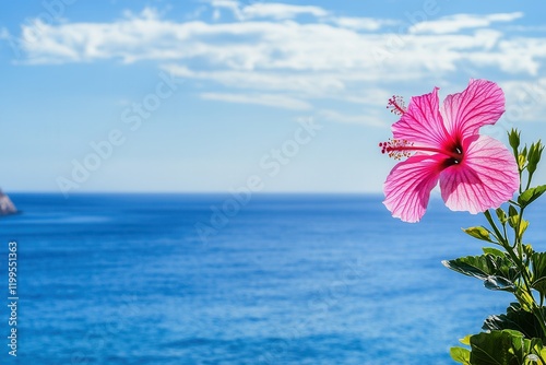 Wallpaper Mural Bright Pink Hibiscus Flower Against a Serene Ocean Backdrop Under a Clear Blue Sky, Capturing the Essence of Tropical Beauty and Natural Tranquility Torontodigital.ca