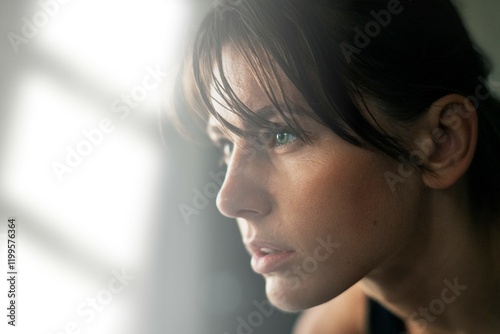 Fotografie Focused sporty woman at the gym