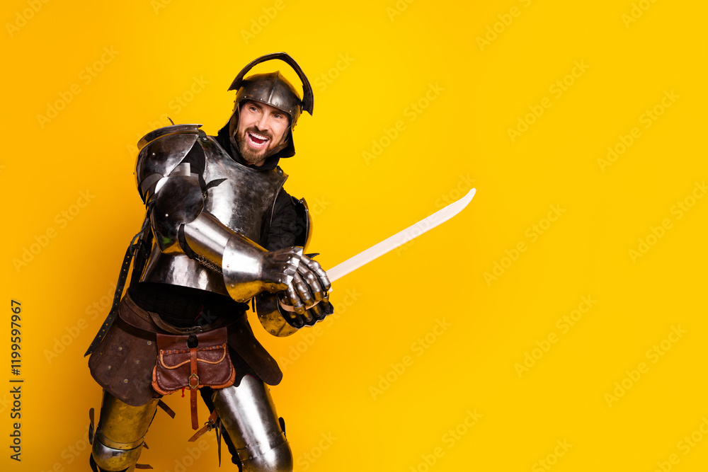 Man Dressed as a Knight Posing With a Sword on a Bright Yellow Background Man Dressed as a Knight Posing With a Sword on a Bright Yellow Background
