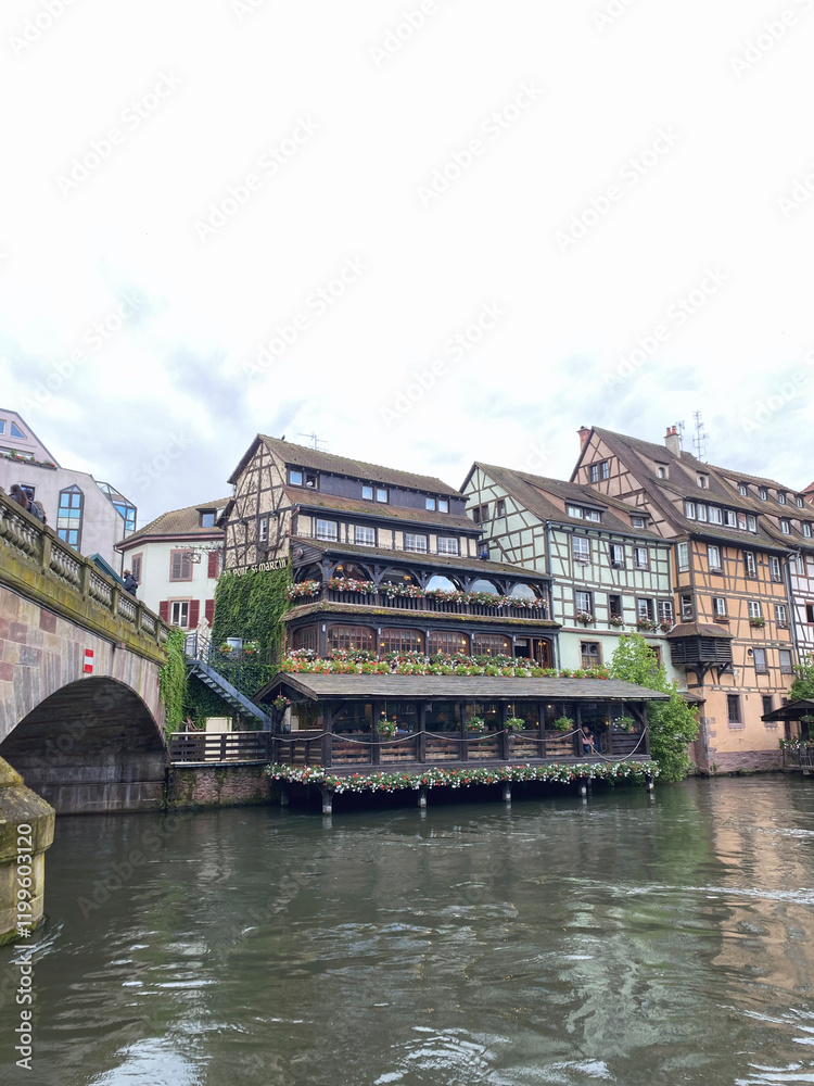 Fototapeta premium Traditional houses in the Petite France district of Strasbourg, showcasing charming half-timbered architecture along the canals