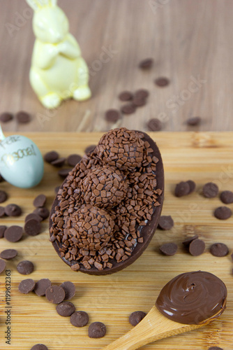 Chocolate Easter egg filled with chocolate ganache. Easter egg with brigadeiro. (Contains the phrase 