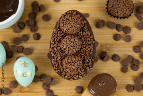 Chocolate Easter egg filled with chocolate ganache. Easter egg with brigadeiro. (Contains the phrase 
