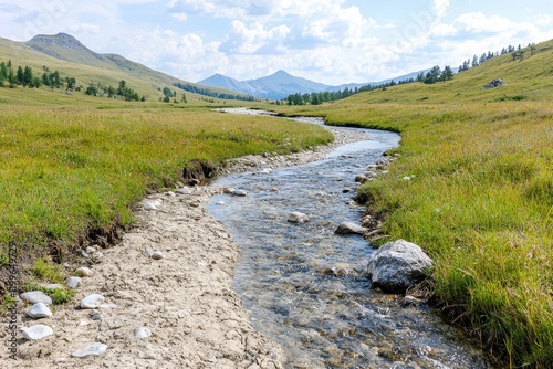 Flowing stream through deforested valley natural landscape tranquil environment
