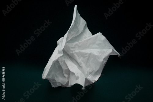 used tissue crumpled isolated on black photo