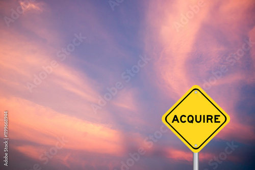 Yellow transportation sign with word acquire on violet color sky background photo