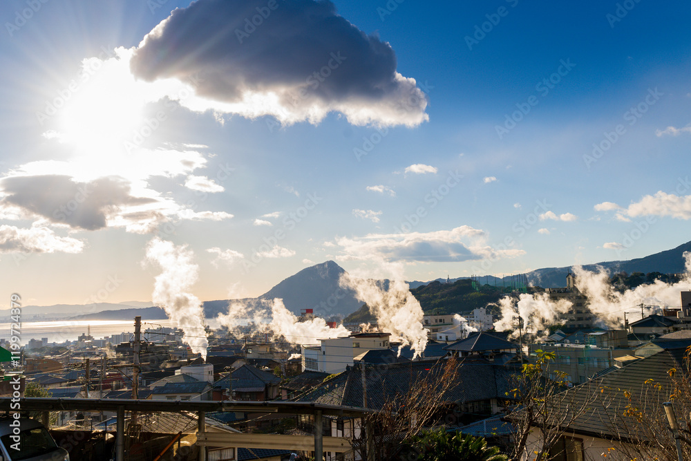 Beppu cityscape with Steam drifted from public hot spring baths and ryokan onsen background, Beppu, Oita, Kyushu, Japan.