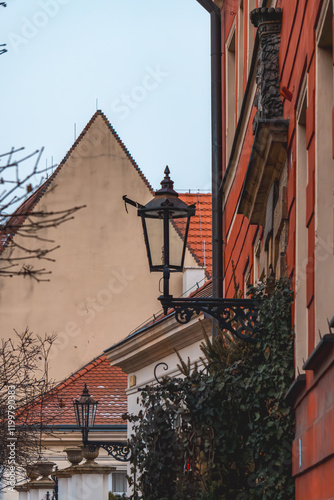 urban architecture in the old town of Wroclaw. old historic beautifully decorated buildings. classic street lamp against the background of colorful beautiful residential tenement houses after renovati photo