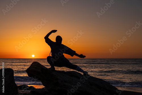 Tai Chi on the beach during beautiful sunrise