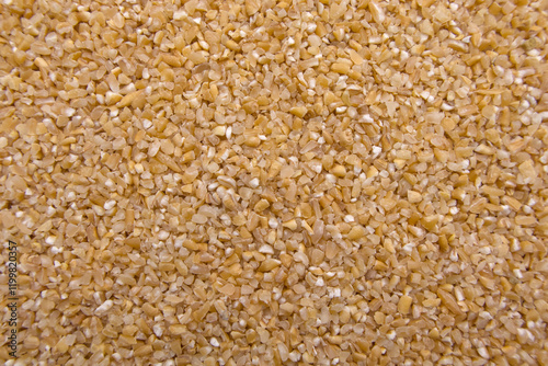 Full-Frame Close-Up of Broken Wheat (Dalia) - Cracked Wheat Texture Macro photo