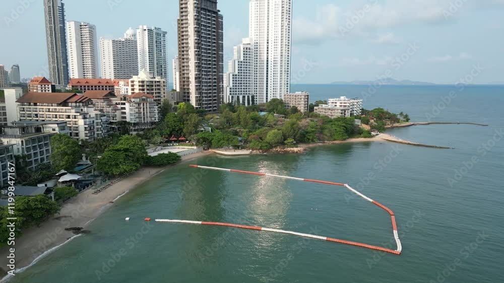 Aerial footage of the Crescent Moon Beach, on a sunny day in the city of Pattaya, Thailand