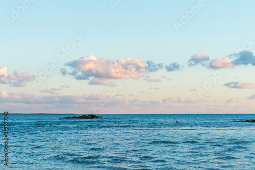 Sunset at Cyprus Beach: Pastel Colors, Clouds over the Sea, Rocky Cliff photo