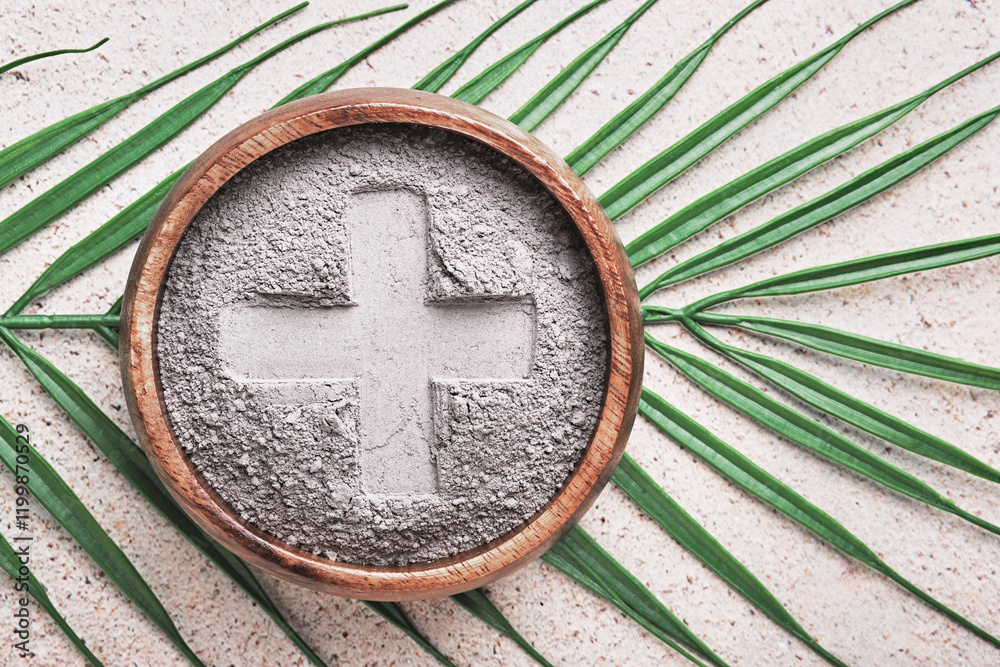 Cross in ashes on a palm leaf background - symbols of Ash Wednesday Cross in ashes on a palm leaf background - symbols of Ash Wednesday