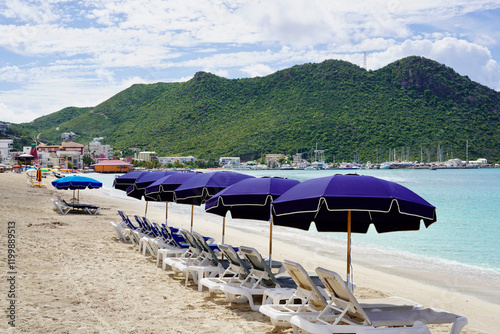 Canvas Print Eastward perspective of beach chairs along Great Bay Beach with green rolling hills in the distance