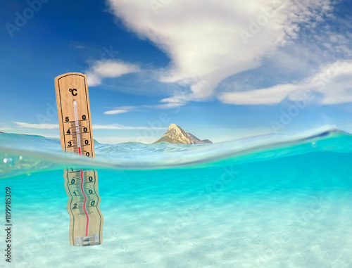 turquoise ocean with underwater view and thermometer, global warming of the oceans
