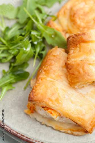 Baked cod fillet in puff pastry with red pesto.