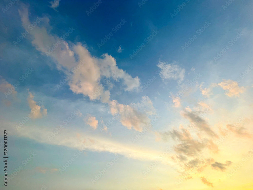 Obraz premium Beautiful sky with natural gradations. Thick clouds in the dusk sky on a winter night. Image of a cloudy sky in the afternoon. View of the night sky with golden light from the evening sun