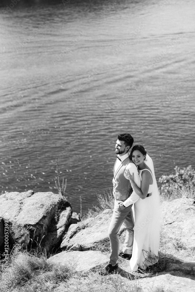 bride blonde girl and groom near the river
