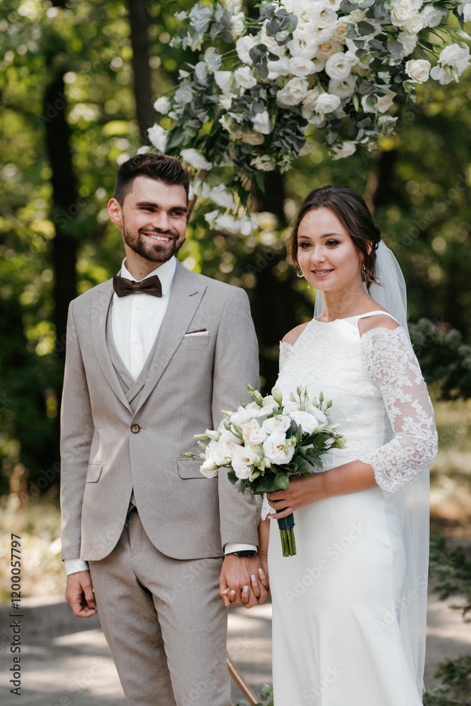 wedding ceremony of the newlyweds on the glade