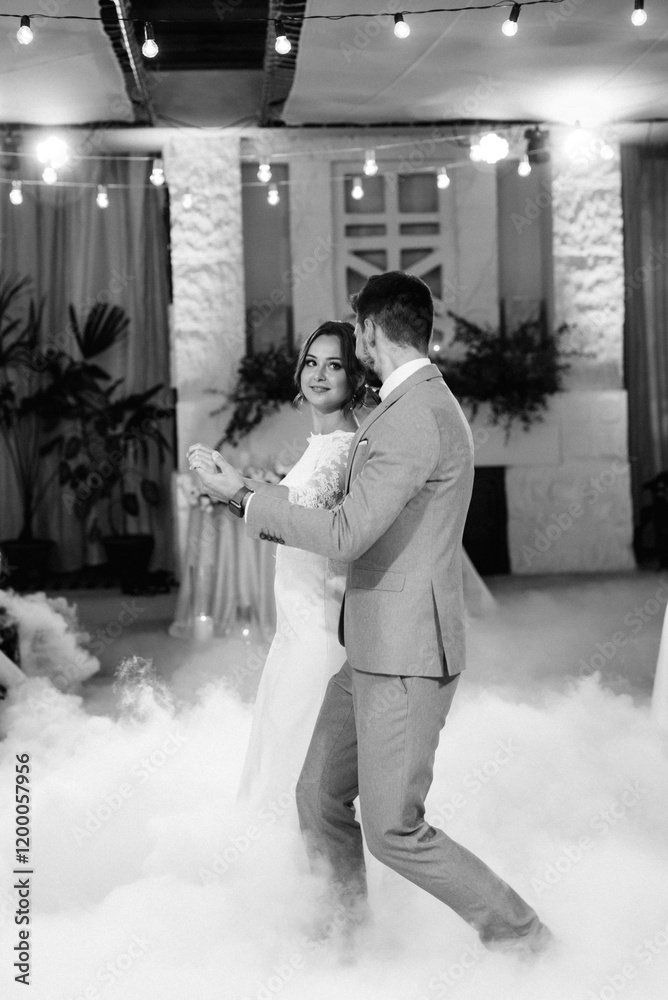 the first dance of the bride and groom inside a restaurant