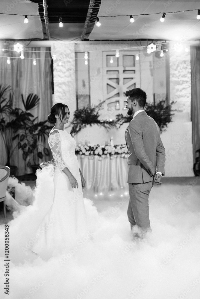 the first dance of the bride and groom inside a restaurant