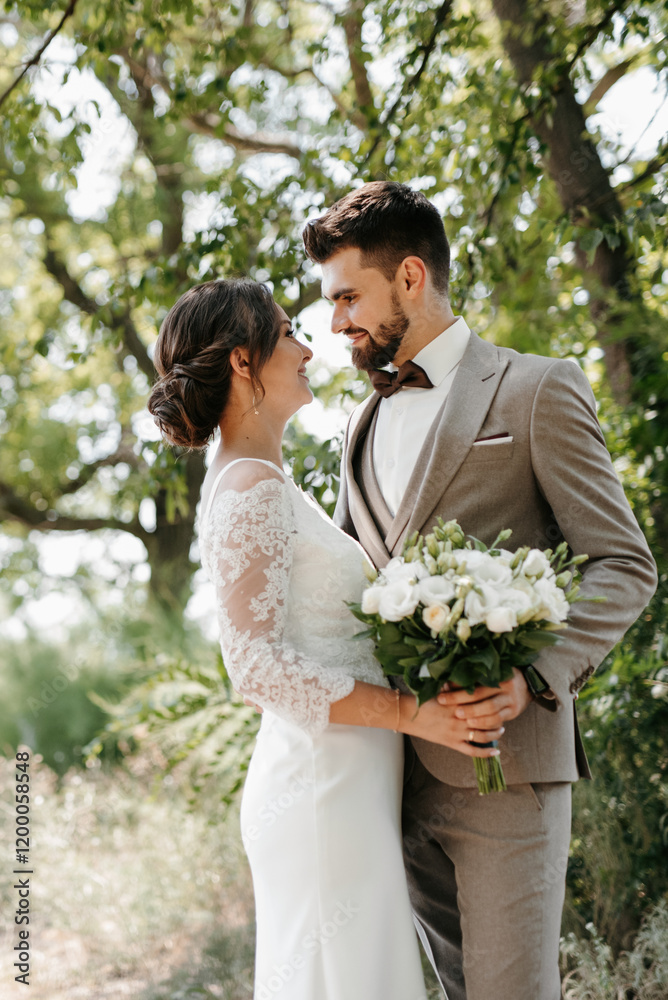 guy and a girl newlyweds are walking in the forest