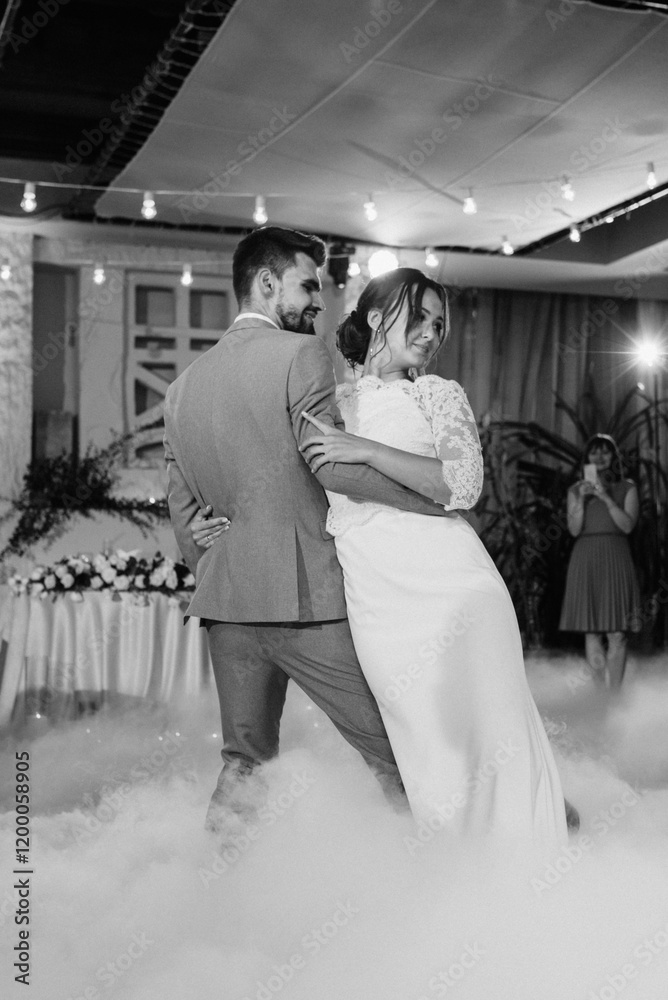 the first dance of the bride and groom inside a restaurant