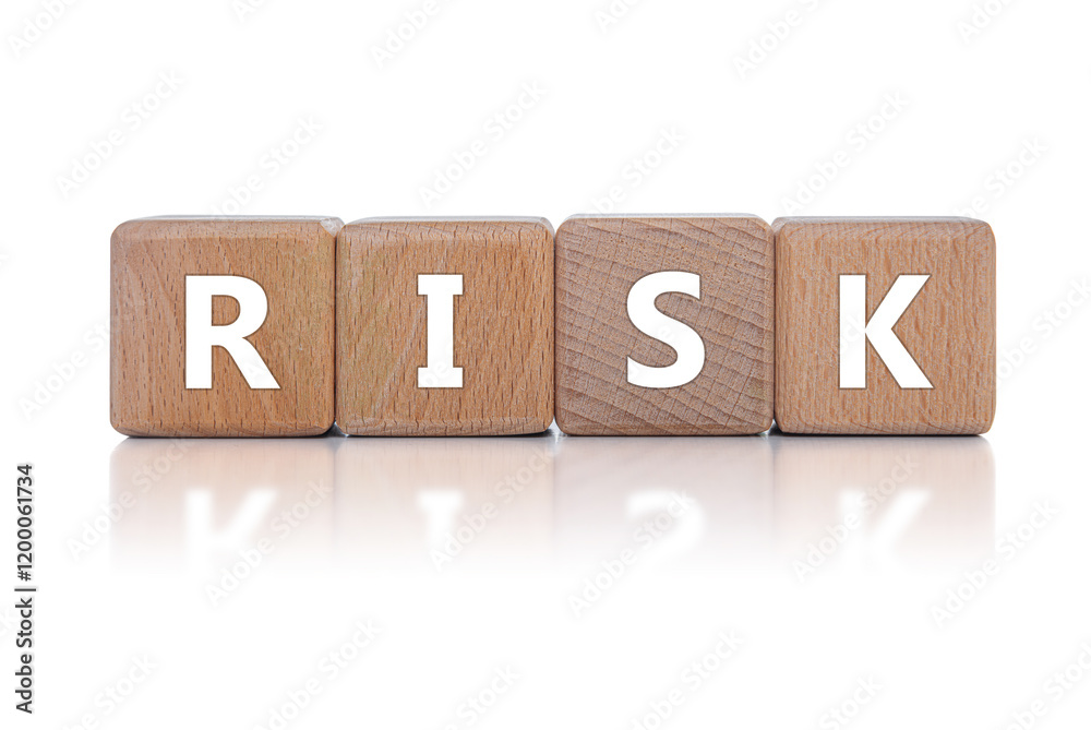 Wooden cubes with the inscription RISK on a white background.