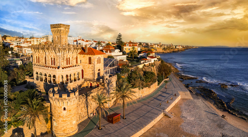 Portugal travel , scenic places. Estoril coastal town over sunset, Aerial drone view of sandy beach Tamariz and castle