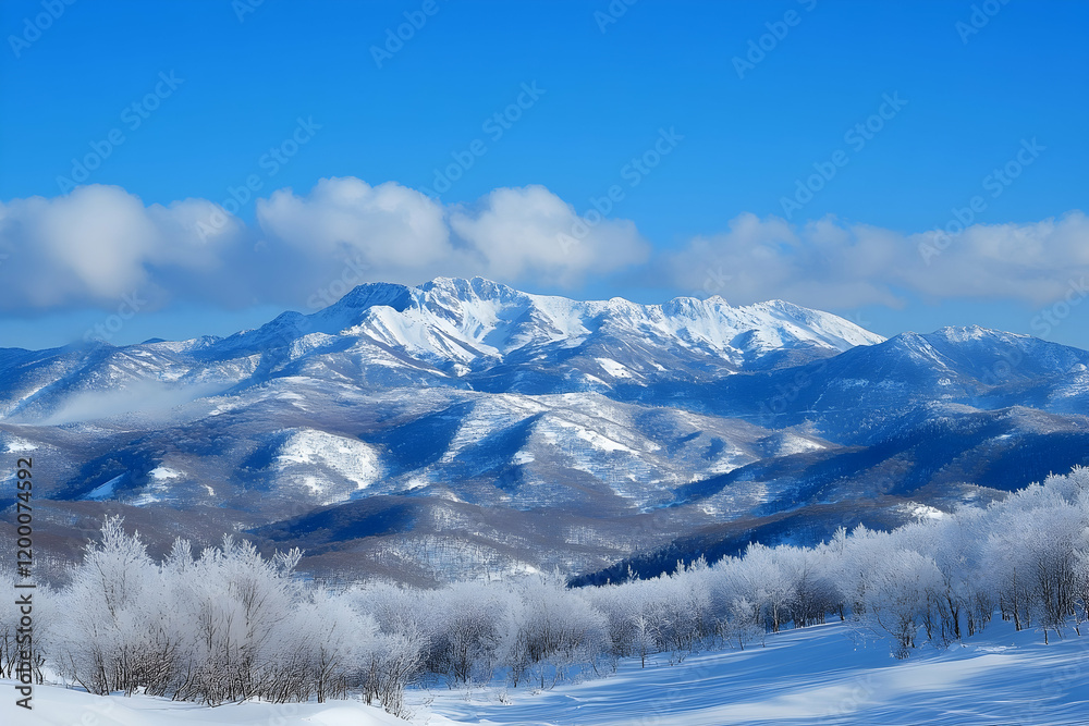 Majestic snow-covered mountain peaks against a vivid blue winter sky Majestic snow-covered mountain peaks against a vivid blue winter sky