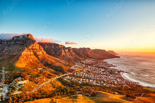 Cape Town Sunset over Camps Bay Beach with Table Mountain and Twelve Apostles in the Background