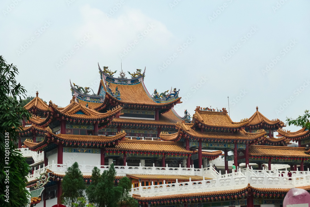 Intricate architecture of Chinese Thean Hou Temple. Roof is adorned with vibrant colors, intricate patterns, decorative figures. Rows of red lanterns hang above entrance. Festive touch. Goddess of Sea Intricate architecture of Chinese Thean Hou Temple. Roof is adorned with vibrant colors, intricate patterns, decorative figures. Rows of red lanterns hang above entrance. Festive touch. Goddess of Sea
