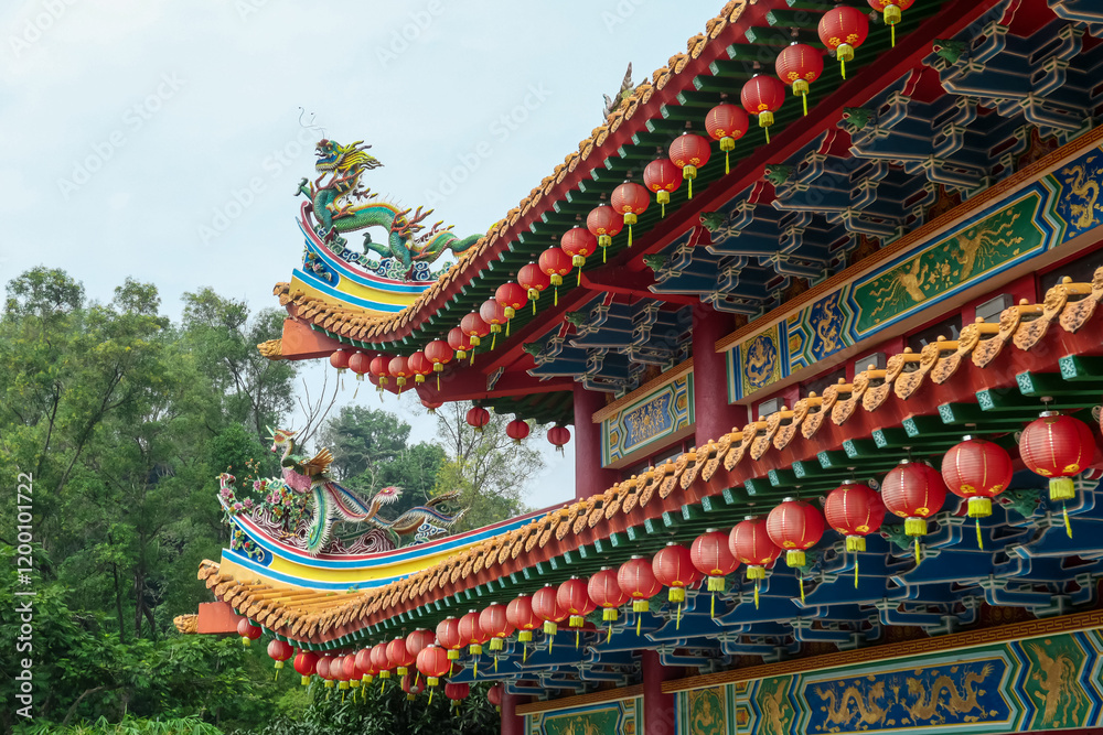Intricate architecture of Chinese Thean Hou Temple. Roof is adorned with vibrant colors, intricate patterns, decorative figures. Rows of red lanterns hang above entrance. Festive touch. Goddess of Sea Intricate architecture of Chinese Thean Hou Temple. Roof is adorned with vibrant colors, intricate patterns, decorative figures. Rows of red lanterns hang above entrance. Festive touch. Goddess of Sea