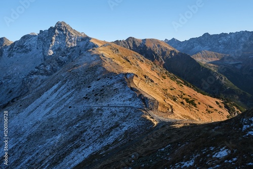 Panorama of Czerwone Wierchy range with Swinica Peak from around Kasprowy Wierch Peak, Tatras Mountains, Poland. During trekking red trail on sunny autumn day.