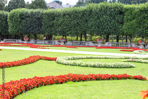 sunny day Salzburg city famous tourist garden with flowers castle Mirabella Austria photo