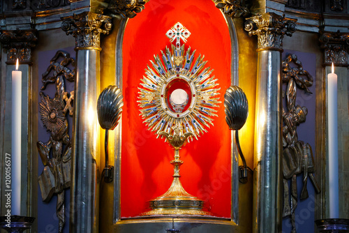 Carmelite Church of St. Joseph.  Eucharist (Blessed Sacrament) inside the Monstrance (Ostensory) during Eucharistic adoration. Regensburg. Germany.
