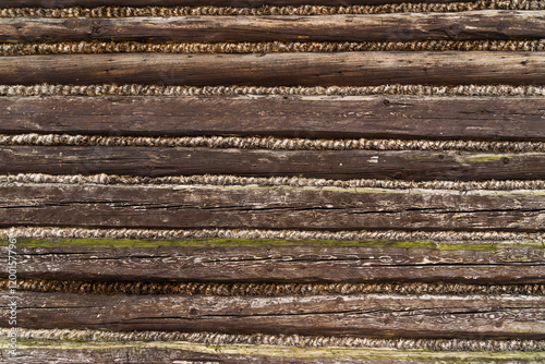 Log structure - Historic house wall as background.