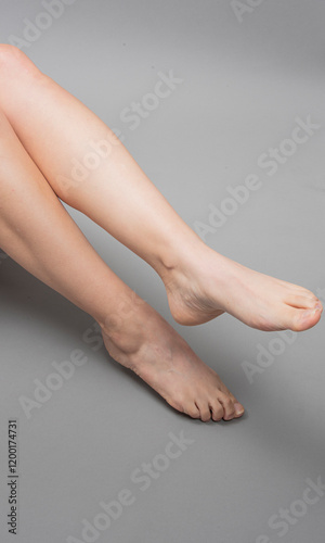 Elegant Leg Silhouettes on a Neutral Background