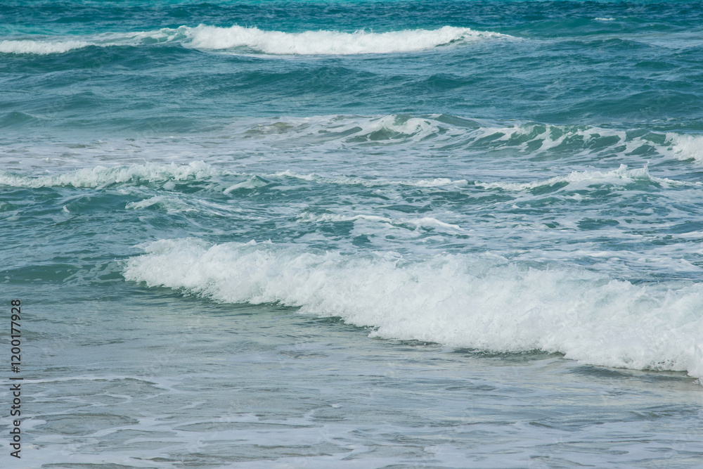 Ocean waves gently breaking on the shore Ocean waves gently breaking on the shore