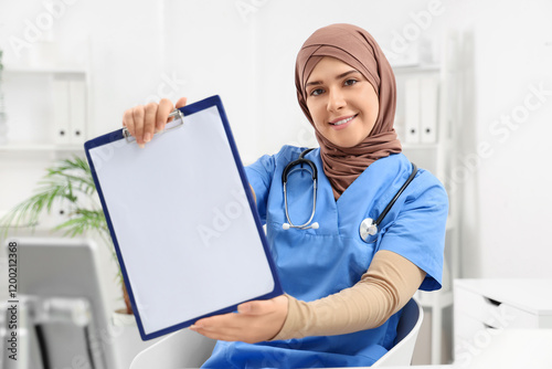 Female Muslim doctor with c...