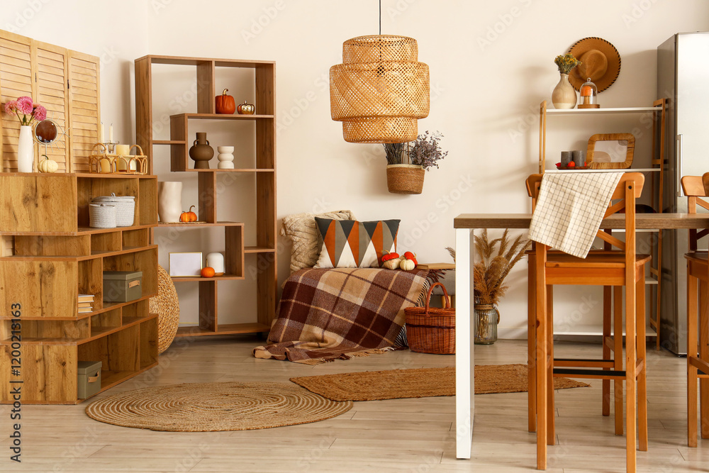 Obraz premium Interior of modern kitchen with wooden furniture and pumpkins