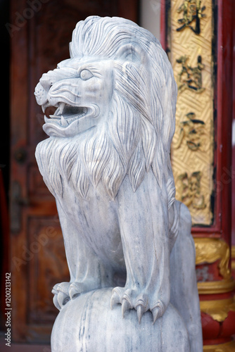 Quan Am Phat Dai buddhist temple. Lion. Guardian of temple. Marble sculpture.  Bac Lieu. Vietnam. . photo