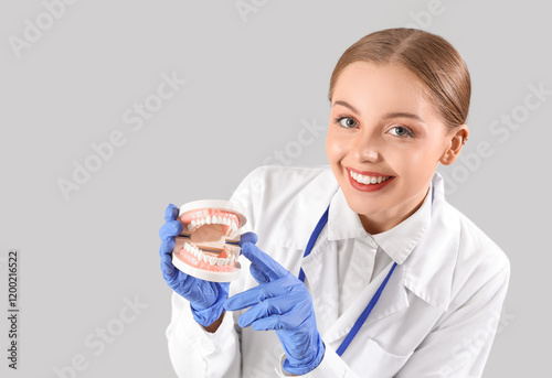 Female dentist with jaw mod...