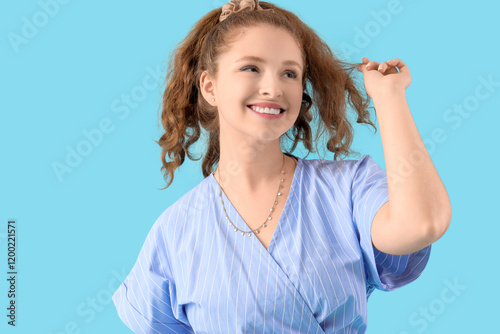Young redhead woman with po...