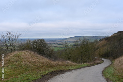 winding countryside road with beautiful surrounding English countryside